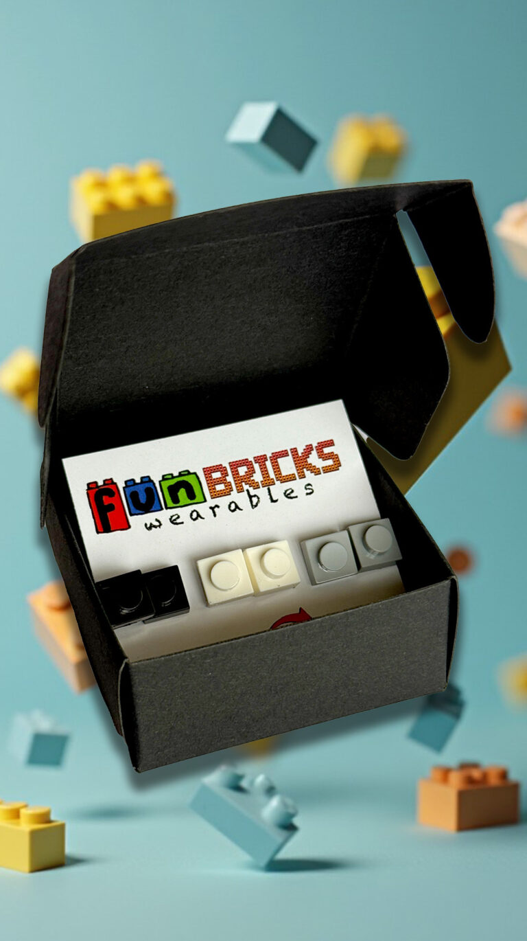 Black gift box containing a BWG Fun Bricks earring set against pastel LEGO bricks.