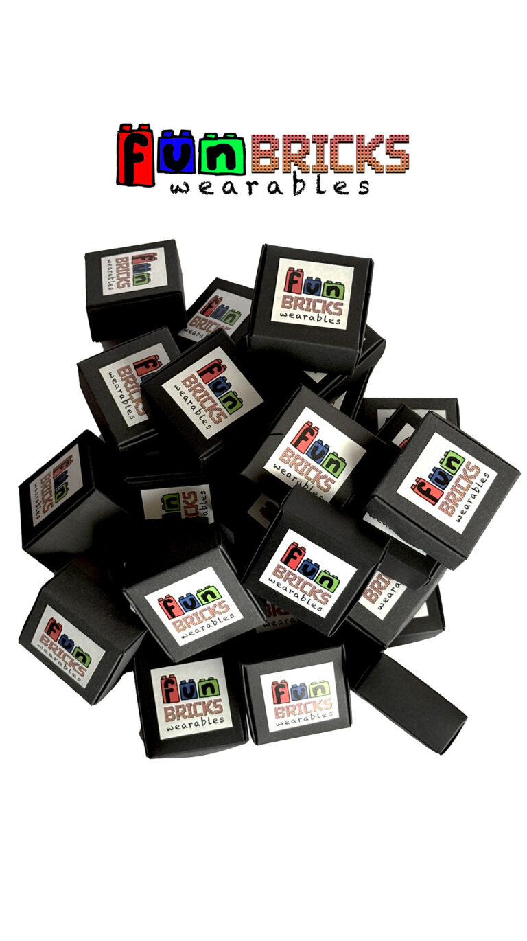 Stack of black gift boxes with the Fun Bricks Wearables logo on each, placed on a white background.