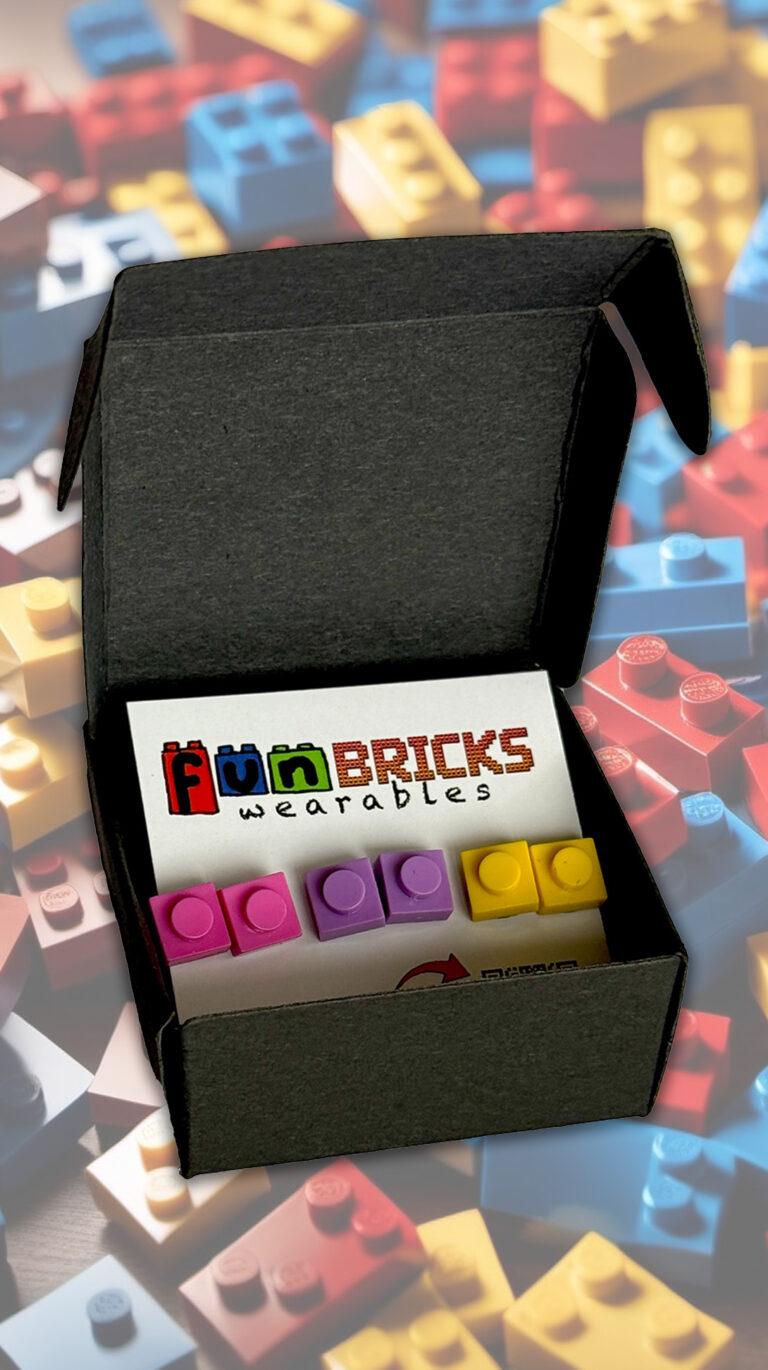 Gift box showing pink, purple, and yellow LEGO-inspired earrings