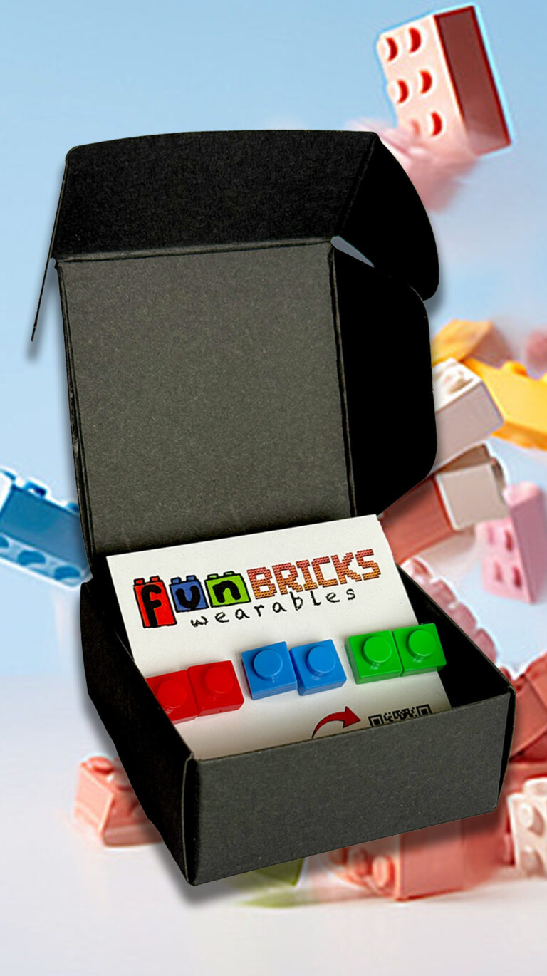 Gift box with red, blue, and green LEGO-inspired earrings inside