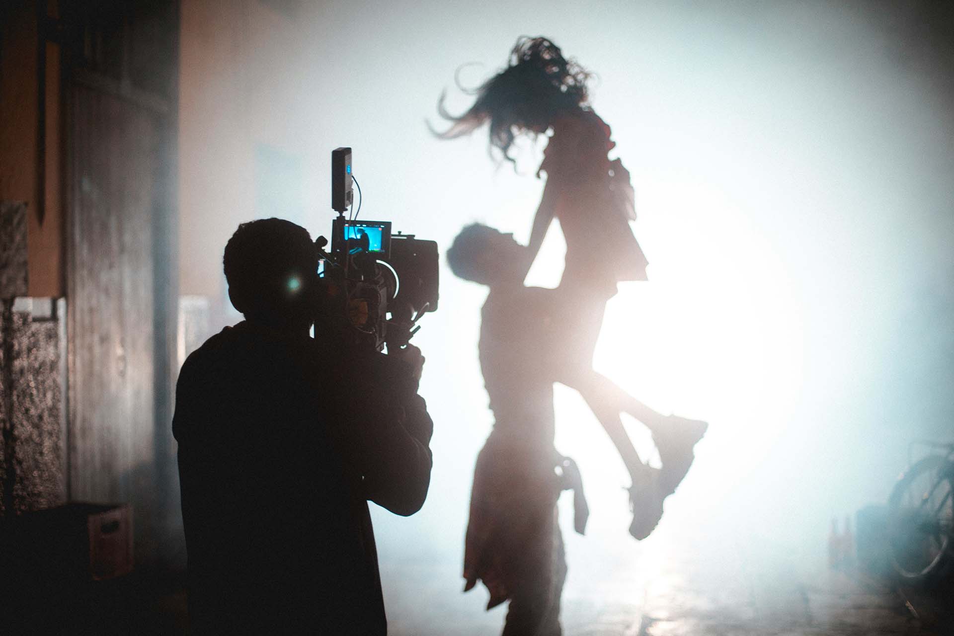 Videography team filming dancers in a cinematic lift for a Vancouver dance studio project
