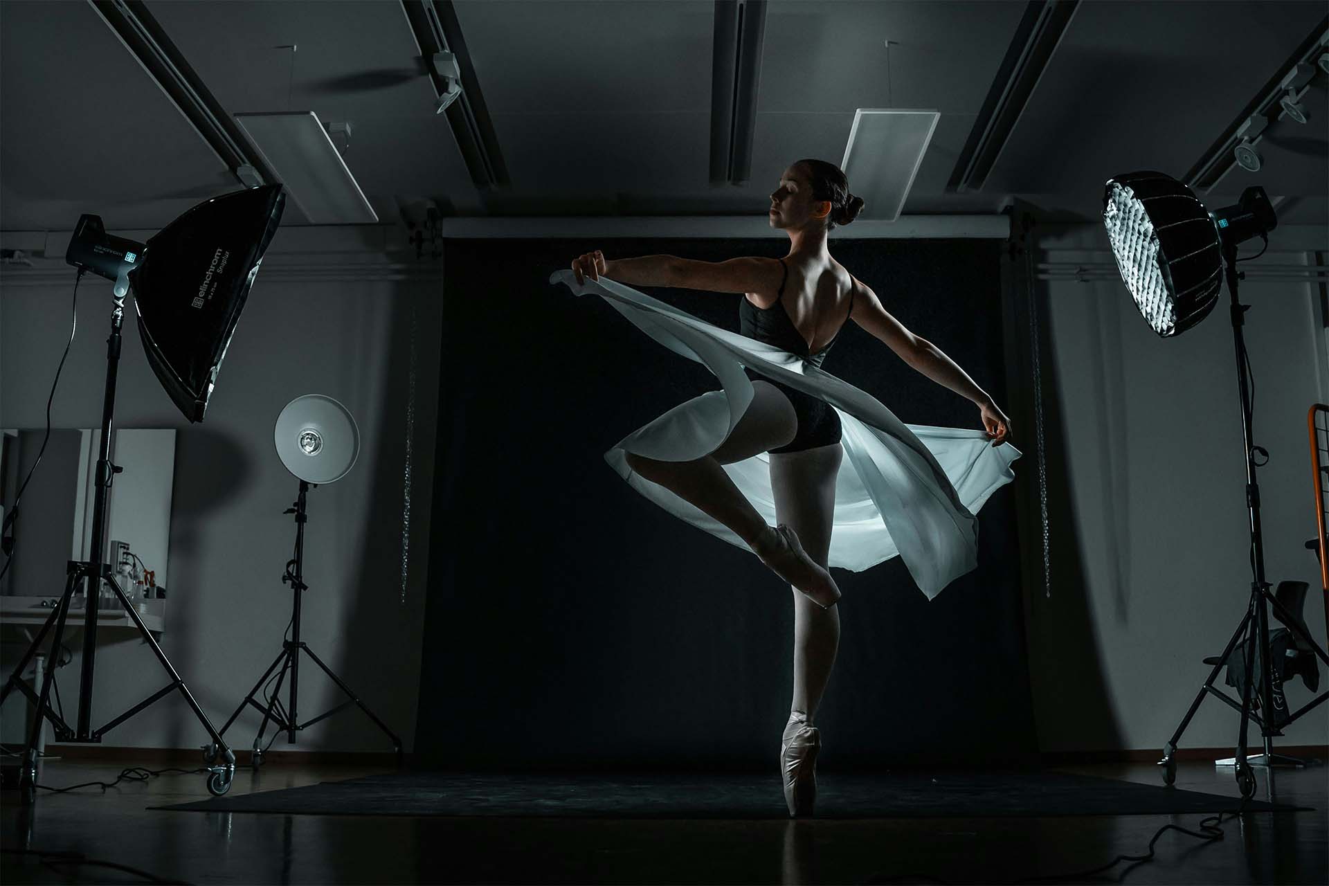 Ballet dancer performing under studio lights during a professional dance videography shoot in BC
