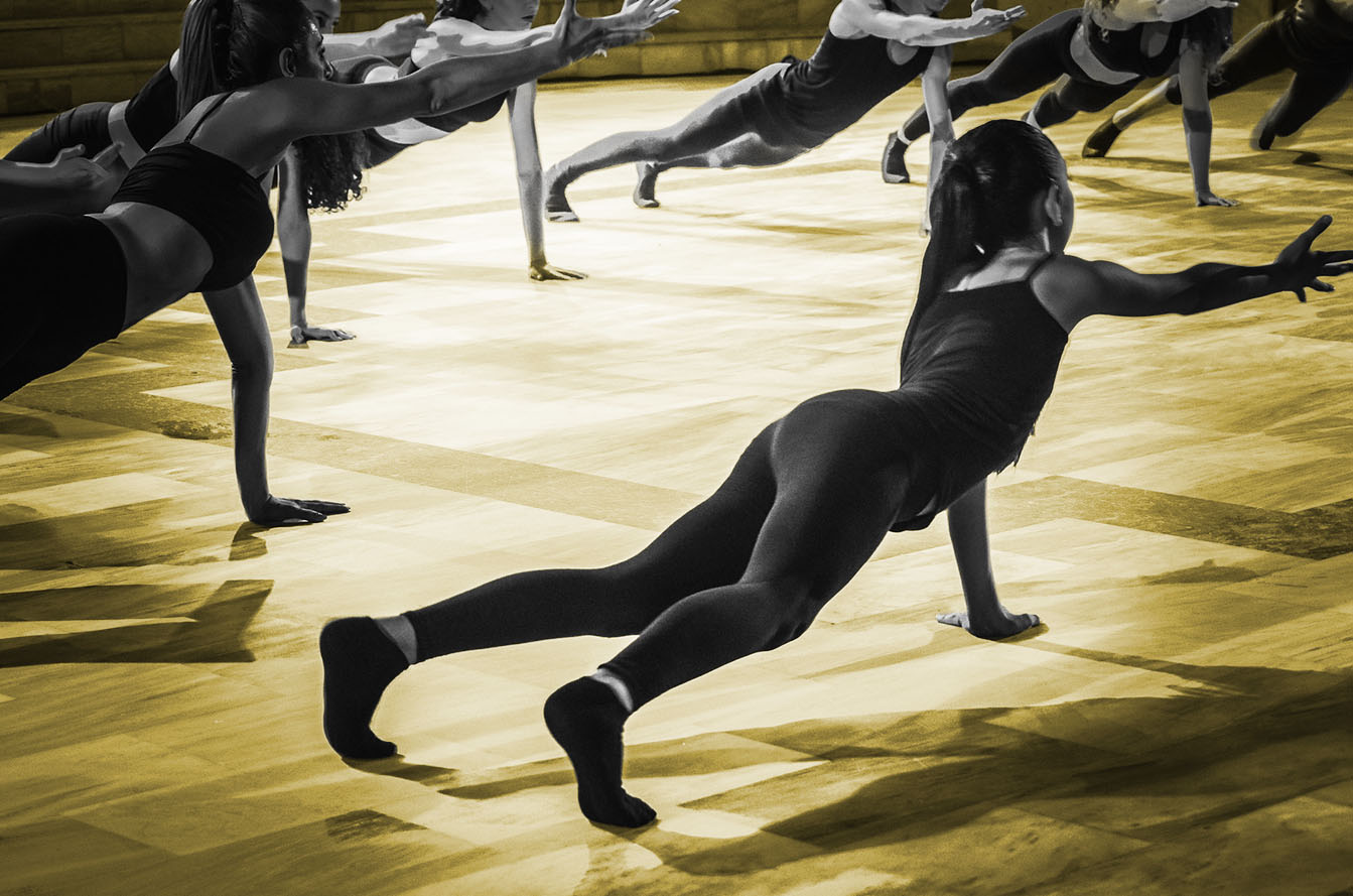 Dancers warming up together during competition season, representing dance rehearsal videos and showcasing studio culture.