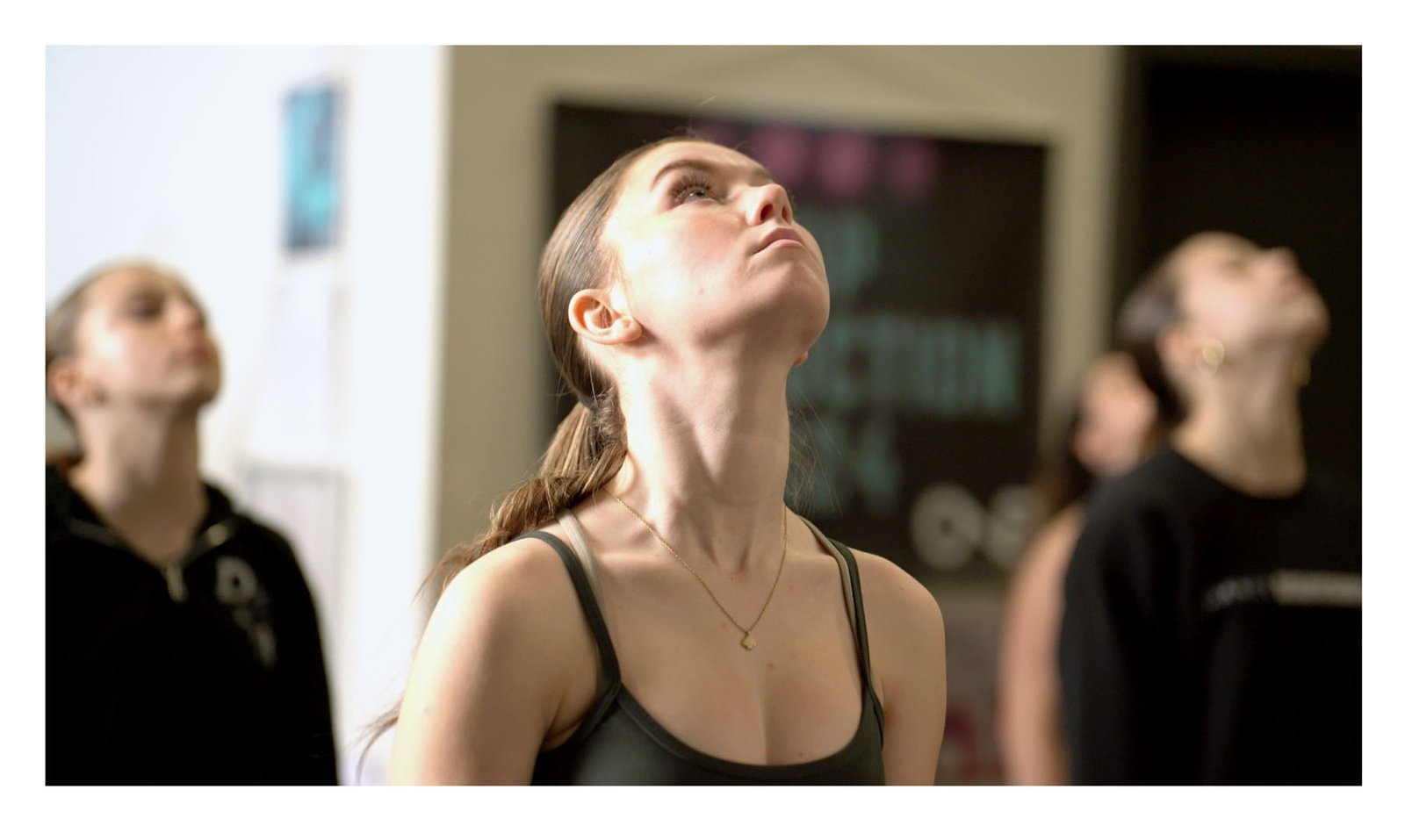 Dancer looking upward while rehearsing choreography at Dance Xpressions
